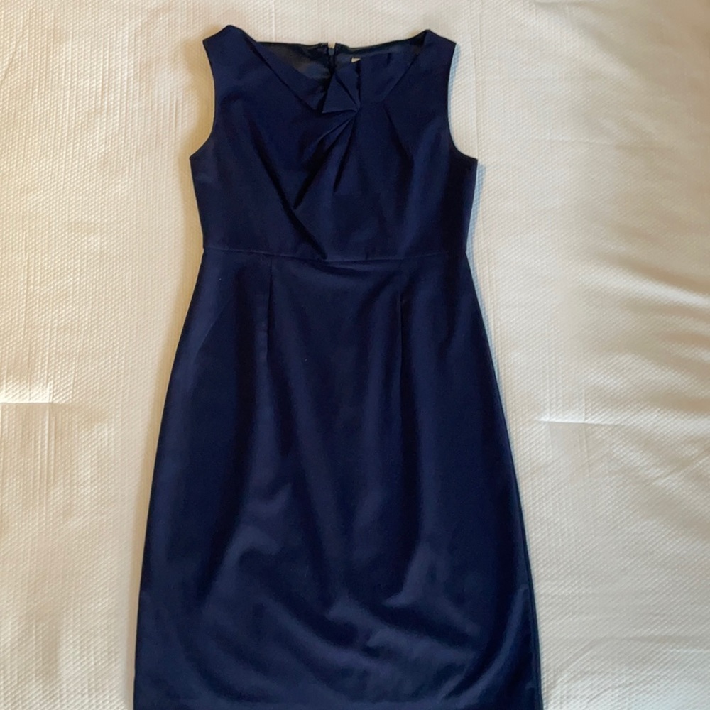Navy blue dress beautiful detail, invisible zipper in back size 2.